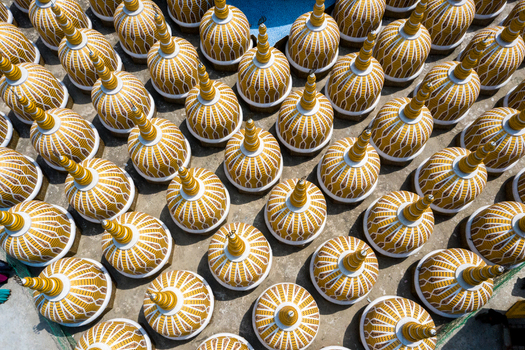 Aerial view of golden domed structures intricately patterned forming a vibrant mosaic across a sunlit surface Tangail Dhaka Division Bangladesh. Aerial view of golden domed structures intricately patterned forming a vibrant mosaic across a sunlit surface Tangail Dhaka Division Bangladesh.