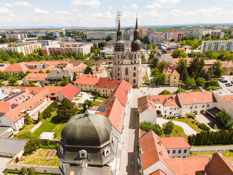 Aerial view of St. Nicholas Basilica and the historic red roofed buildings of the old town in Trnava Trnava Region Slovakia. Aerial view of St. Nicholas Basilica and the historic red roofed buildings of the old town in Trnava Trnava Region Slovakia.
