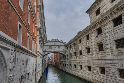 Venice Veneto Italy 06 May 2022 View of the historic Bridge of Sighs spanning the canal between the Doge s Palace and the prison with ornate stone architecture and barred windows.