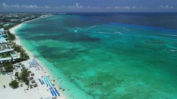 Aerial view of Grand Cayman beach and turquoise sea Cayman Islands. Aerial view of Grand Cayman beach and turquoise sea Cayman Islands.