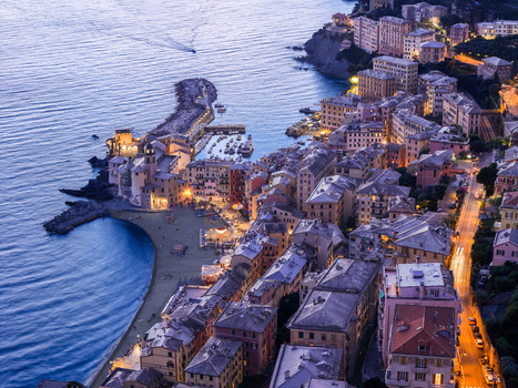 Aerial view of Camogli with its colorful buildings small harbor and illuminated streets at dusk in Camogli Liguria Italy. Aerial view of Camogli with its colorful buildings small harbor and illuminated streets at dusk in Camogli Liguria Italy.