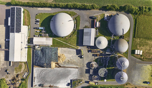 Schleswig Schleswig Holstein Germany 26 June 2026 Aerial view of biogas works with fermentation tanks storage silos and processing areas surrounded by green fields. Schleswig Schleswig Holstein Germany 26 June 2026 Aerial view of biogas works with fermentation tanks storage silos and processing areas surrounded by green fields.