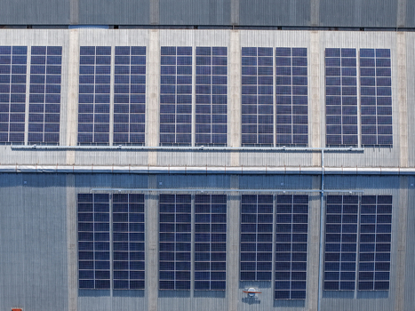 Aerial view of solar panels installed on the metal roof of a factory in Kilsyth South Melbourne VIC Australia. Aerial view of solar panels installed on the metal roof of a factory in Kilsyth South Melbourne VIC Australia.