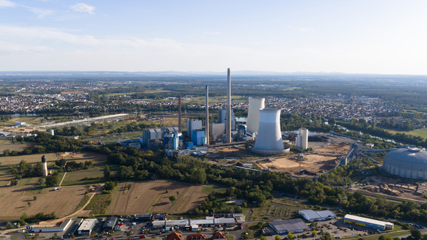 Aerial view of Staudinger Power Plant near Hanau Germany showing coal and gas generation units cooling towers chimneys and major electricity infrastructure on the Main River. Aerial view of Staudinger Power Plant near Hanau Germany showing coal and gas generation units cooling towers chimneys and major electricity infrastructure on the Main River.