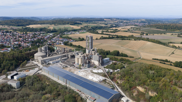Aerial view of the OPTERRA Wossingen GmbH cement plant with large industrial silos conveyor systems and surrounding rural fields in Walzbachtal Baden Wurttemberg Germany. Aerial view of the OPTERRA Wossingen GmbH cement plant with large industrial silos conveyor systems and surrounding rural fields in Walzbachtal Baden Wurttemberg Germany.
