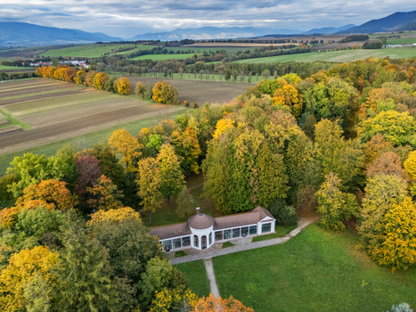 Aerial view of the elegant Mosovce Manor House its classical architecture nestled amidst a vibrant tapestry of fiery autumn foliage Mosovce Zilina Region Slovakia. Aerial view of the elegant Mosovce Manor House its classical architecture nestled amidst a vibrant tapestry of fiery autumn foliage Mosovce Zilina Region Slovakia.