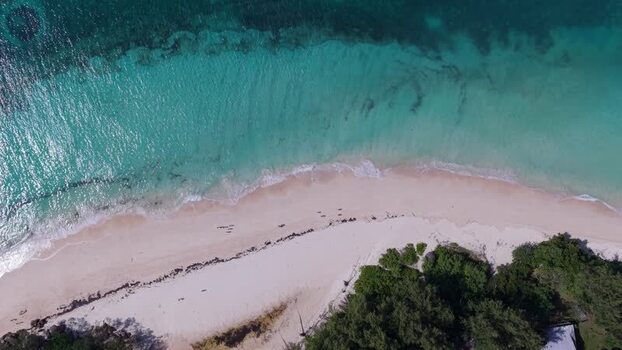 Aerial view of Curieuse Island beach in Baie Sainte Anne Seychelles.