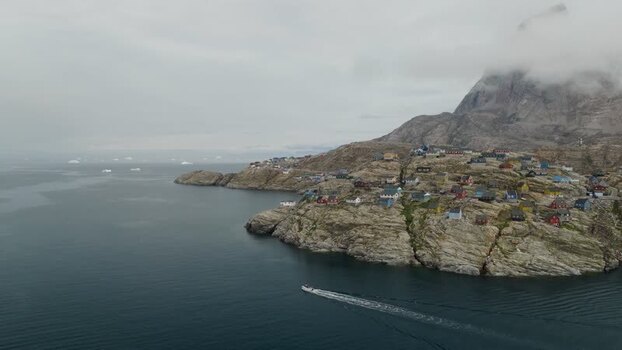 Aerial view of Uummannaq town on rocky coast Greenland. Aerial view of Uummannaq town on rocky coast Greenland.