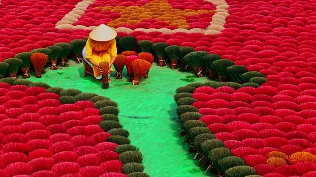 View of incense sticks forming a flag pattern Vietnam.