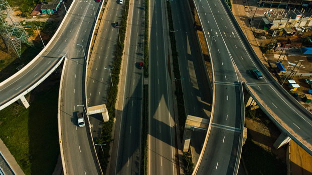 Aerial view of the Pokuase interchange featuring multi level highway ramps concrete pillars and sparse traffic in Ga North Municipal Greater Accra Region Ghana. Aerial view of the Pokuase interchange featuring multi level highway ramps concrete pillars and sparse traffic in Ga North Municipal Greater Accra Region Ghana.