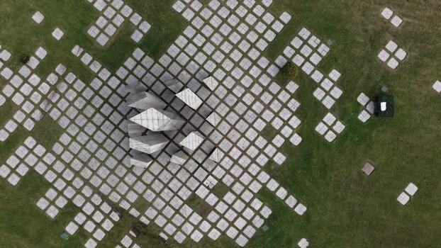 Aerial view of Cubist monument and grass Portugal.