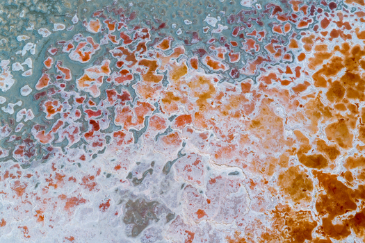 Aerial view of the vibrant mineral crusts and colorful salt deposits of Searles Lake San Bernardino County California United States. Aerial view of the vibrant mineral crusts and colorful salt deposits of Searles Lake San Bernardino County California United States.