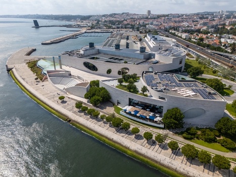 Lisboa Portugal 25 July 2026 Aerial view of the Champalimaud Foundation a modern architectural landmark with curved stone walls and landscaped gardens along the Tagus River waterfront.