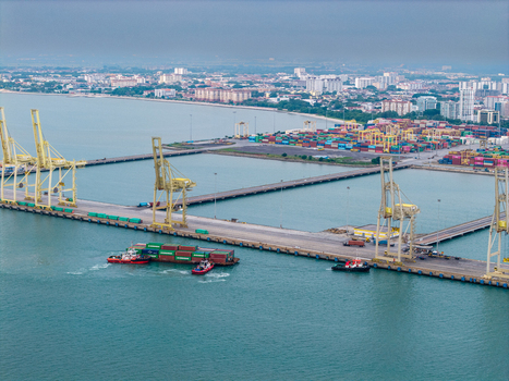 Butterworth Penang Malaysia 22 September 2026 Aerial view of North Butterworth Container Terminal with gantry cranes shipping containers and tugboats in the harbor. Butterworth Penang Malaysia 22 September 2026 Aerial view of North Butterworth Container Terminal with gantry cranes shipping containers and tugboats in the harbor.