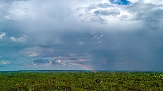 Aerial view of a rainbow over a green forest Latvia. Aerial view of a rainbow over a green forest Latvia.
