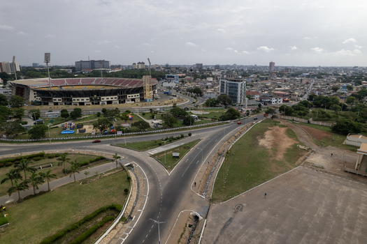 Aerial view of a vibrant cityscape where Ohene Djan Sports Stadium stands out contrasting with the intricate network of streets Accra Ghana. Aerial view of a vibrant cityscape where Ohene Djan Sports Stadium stands out contrasting with the intricate network of streets Accra Ghana.