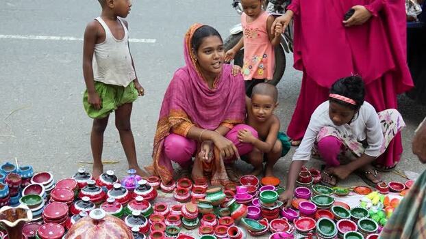 View of a woman and children selling colorful pottery Bangladesh. View of a woman and children selling colorful pottery Bangladesh.