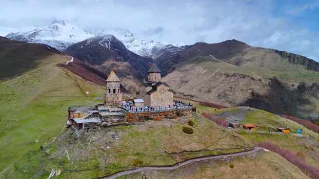 Aerial view of Gergeti Trinity Church and mountains Georgia.