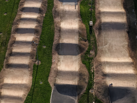 Melbourne Australia 22 September 2026 Aerial view of a dirt bmx track with series of mounds and jumps surrounded by green grass. Melbourne Australia 22 September 2026 Aerial view of a dirt bmx track with series of mounds and jumps surrounded by green grass.