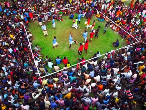 Nilphamari Bangladesh 01 May 2026 Aerial view of a traditional Lathi Khela stick fighting performance in a green field surrounded by a large crowd of spectators. Nilphamari Bangladesh 01 May 2026 Aerial view of a traditional Lathi Khela stick fighting performance in a green field surrounded by a large crowd of spectators.