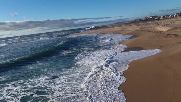 Aerial view of beach meeting the sea Portugal.