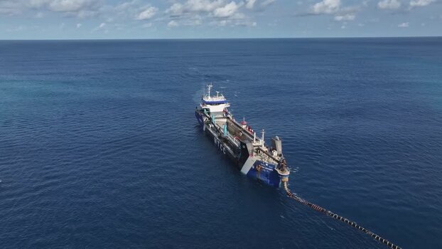 Aerial view of an industrial ship in the blue ocean Maldives. Aerial view of an industrial ship in the blue ocean Maldives.