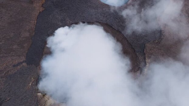 Aerial view of smoke rising from Erta Ale Volcano crater Ethiopia. Aerial view of smoke rising from Erta Ale Volcano crater Ethiopia.