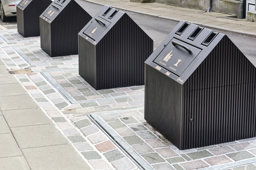 Viborg Denmark 07 August 2026 View of modern waste management containers with a distinctive house like design installed on a cobblestone street in the historic old town of Viborg. Viborg Denmark 07 August 2026 View of modern waste management containers with a distinctive house like design installed on a cobblestone street in the historic old town of Viborg.