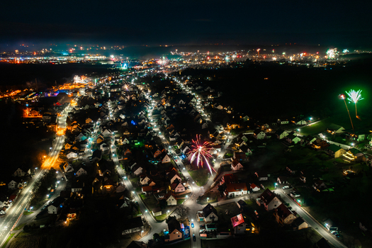 Aerial view of fireworks exploding over the illuminated houses and streets of the town at night Forchheim Bavaria Germany. Aerial view of fireworks exploding over the illuminated houses and streets of the town at night Forchheim Bavaria Germany.