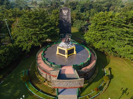 Purwokerto Indonesia 08 May 2026 Aerial view of the National Monument of Jendral Soedirman featuring a statue on horseback surrounded by lush green trees and a tall black obelisk. Purwokerto Indonesia 08 May 2026 Aerial view of the National Monument of Jendral Soedirman featuring a statue on horseback surrounded by lush green trees and a tall black obelisk.