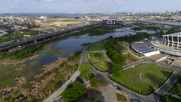 Aerial view of the Wole Soyinka Centre for Culture and Creative Arts and National Theatre Nigeria with the Eko Bridge and surrounding urban landscape in Lagos Lagos Nigeria. Aerial view of the Wole Soyinka Centre for Culture and Creative Arts and National Theatre Nigeria with the Eko Bridge and surrounding urban landscape in Lagos Lagos Nigeria.
