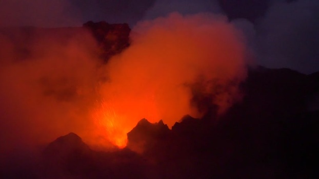 View of Stromboli volcano erupting at night Italy.