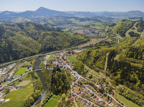 Aerial view of the historic Orava Castle on a steep rock above the Orava river and the village surrounded by lush green hills Oravsky Podzamok Zilina Region Slovakia. Aerial view of the historic Orava Castle on a steep rock above the Orava river and the village surrounded by lush green hills Oravsky Podzamok Zilina Region Slovakia.