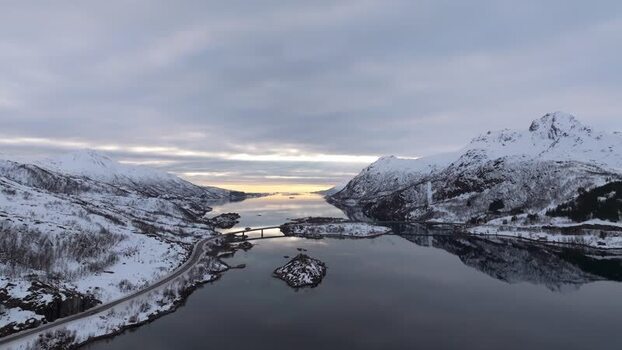 Aerial view of Lofoten mountains and bridge over fjord Norway.