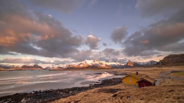 View of Lofoten mountains and traditional houses in Norway. View of Lofoten mountains and traditional houses in Norway.