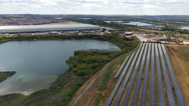 Aerial view of solar farm and distribution centre United Kingdom.