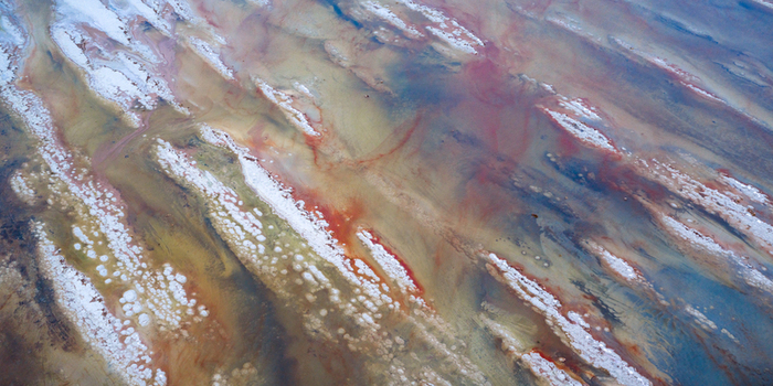 Aerial view of a tapestry of earthy hues interwoven with streaks of chalky white resembling an abstract painting Salt lake city Utah United States. Aerial view of a tapestry of earthy hues interwoven with streaks of chalky white resembling an abstract painting Salt lake city Utah United States.