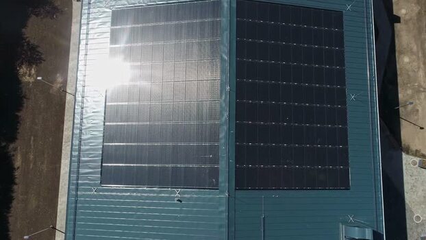 Aerial view of solar panels on a roof in Latvia.