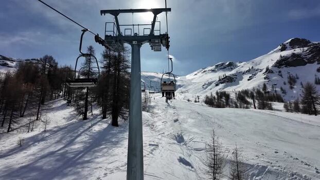 View of ski lift and snowy mountains Italy. View of ski lift and snowy mountains Italy.