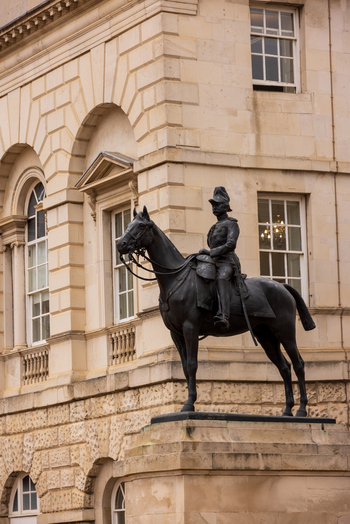 London United Kingdom 12 May 2025 View of the equestrian statue of Earl Haig standing in front of the historic stone facade of the Old War Office building on Whitehall.