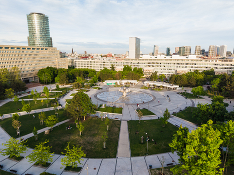Aerial view of Freedom Square featuring the large circular fountain surrounded by green lawns and modern skyscrapers in Bratislava I Bratislavsky kraj Slovakia. Aerial view of Freedom Square featuring the large circular fountain surrounded by green lawns and modern skyscrapers in Bratislava I Bratislavsky kraj Slovakia.
