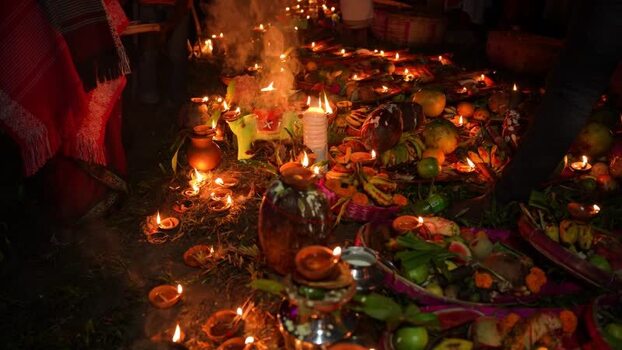 View of religious offerings and lit oil lamps at night Bangladesh. View of religious offerings and lit oil lamps at night Bangladesh.