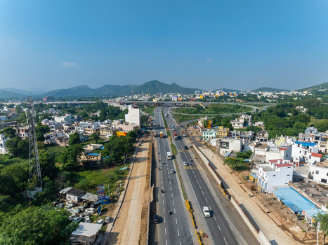 Aerial view of a multi lane highway stretching through the urban landscape of Udaipur Rajasthan India. Aerial view of a multi lane highway stretching through the urban landscape of Udaipur Rajasthan India.