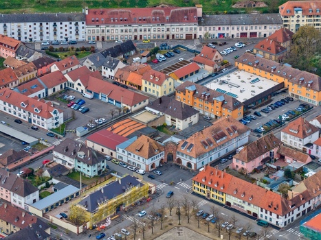 Aerial view of the star shaped fortress with its symmetrical layout terracotta rooftops and orderly streets Neuf Brisach Grand Est France.