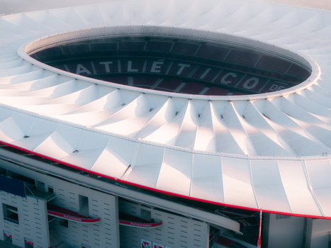 Aerial view of Riyadh Air Metropolitano Stadium with its distinctive white membrane roof structure and circular design in Madrid Comunidad de Madrid Spain.