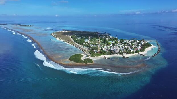 Aerial view of Thulusdhoo island and its turquoise lagoon Maldives. Aerial view of Thulusdhoo island and its turquoise lagoon Maldives.