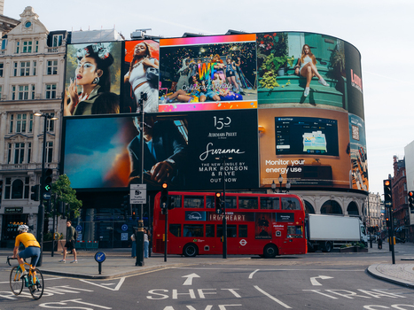 London United Kingdom 20 June 2025 View of Piccadilly Circus s vibrant digital billboards towering above the iconic red double decker bus a symphony of color and motion. London United Kingdom 20 June 2025 View of Piccadilly Circus s vibrant digital billboards towering above the iconic red double decker bus a symphony of color and motion.