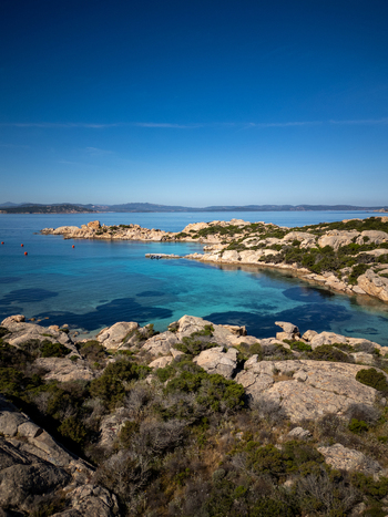 Aerial view of the rocky coastline of Carlotto with turquoise waters and granite formations in La Maddalena Sardinia Italy. Aerial view of the rocky coastline of Carlotto with turquoise waters and granite formations in La Maddalena Sardinia Italy.