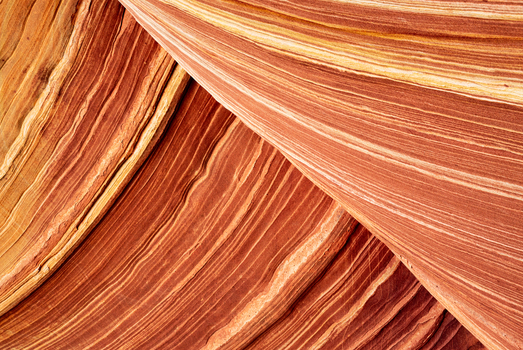View of the swirling sandstone layers and undulating rock formations at The Wave in Kanab Arizona United States. View of the swirling sandstone layers and undulating rock formations at The Wave in Kanab Arizona United States.