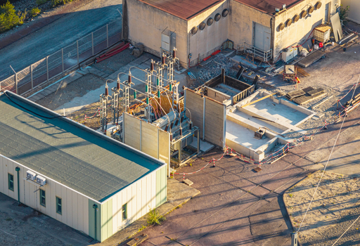 Aerial view of electrical substation equipment with construction works and a new foundation in Rousset Serre Poncon Provence Alpes Cote d Azur France.